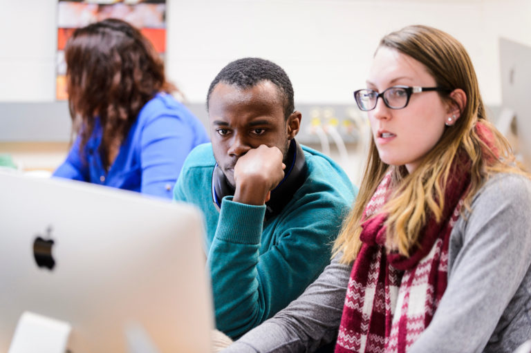 Undergraduate students Dirk Spencer and Keighley Reisenauer work on a project in a computer lab as part of a Genomics and Proteomics class taught by Ahna Skop, associate professor of genetics and life sciences communication, in the Animal Sciences Building at the University of Wisconsin-Madison on Feb. 11, 2016. Skop is one of twelve 2016 Distinguished Teaching Award recipients. (Photo by Jeff Miller/UW-Madison)