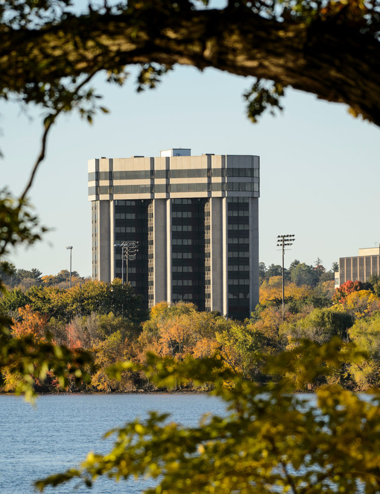 The Wisconsin Alumni Research Foundation Building (WARF) and Lake Mendota shoreline are seen from Picnic Point at the University of Wisconsin-Madison