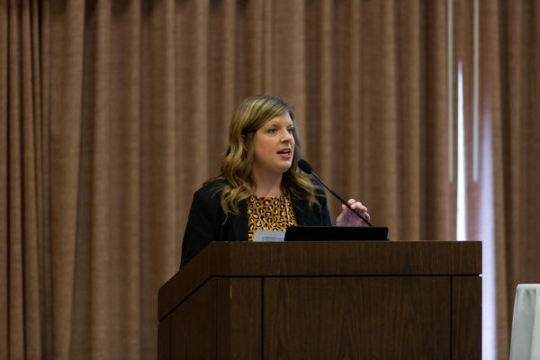 Image of a woman at a podium