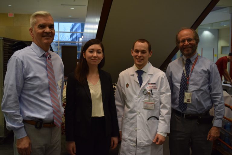 cancer biology graduate student Kristine Donahue and UW Human Oncology resident Dr. Jacob Witt pictured with Carbone Cancer Center Director Dr. Howard Bailey and SMPH Dean Dr. Robert Golden