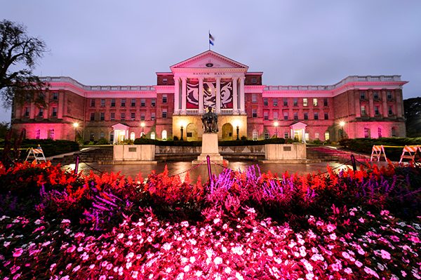 In honor of breast cancer awareness month, pink-colored accent lighting illuminates the exterior of Bascom Hall and terrace plantings surrounding the Abraham Lincoln statue at the University of Wisconsin-Madison
